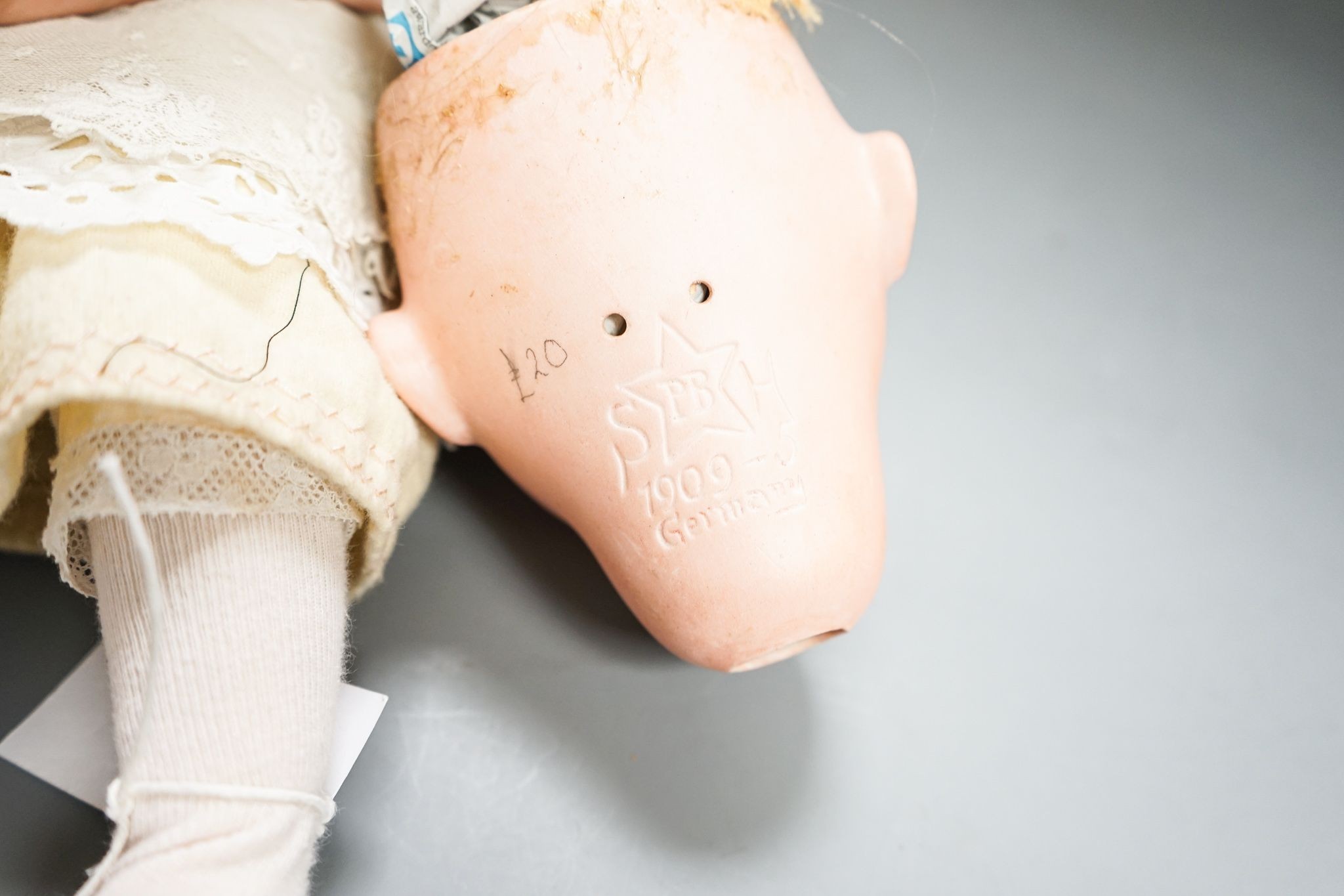J D Kestner, bisque doll and a Schwenau & Hoffmeister bisque head